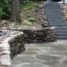 Bluestone patio, fieldstone retaining wall and granite steps
