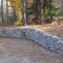 Beautifully curved fieldstone retaining wall in historic district